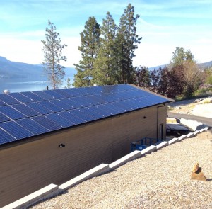 60 250w solar panels mounted on a rooftop in McKinley landing BC
